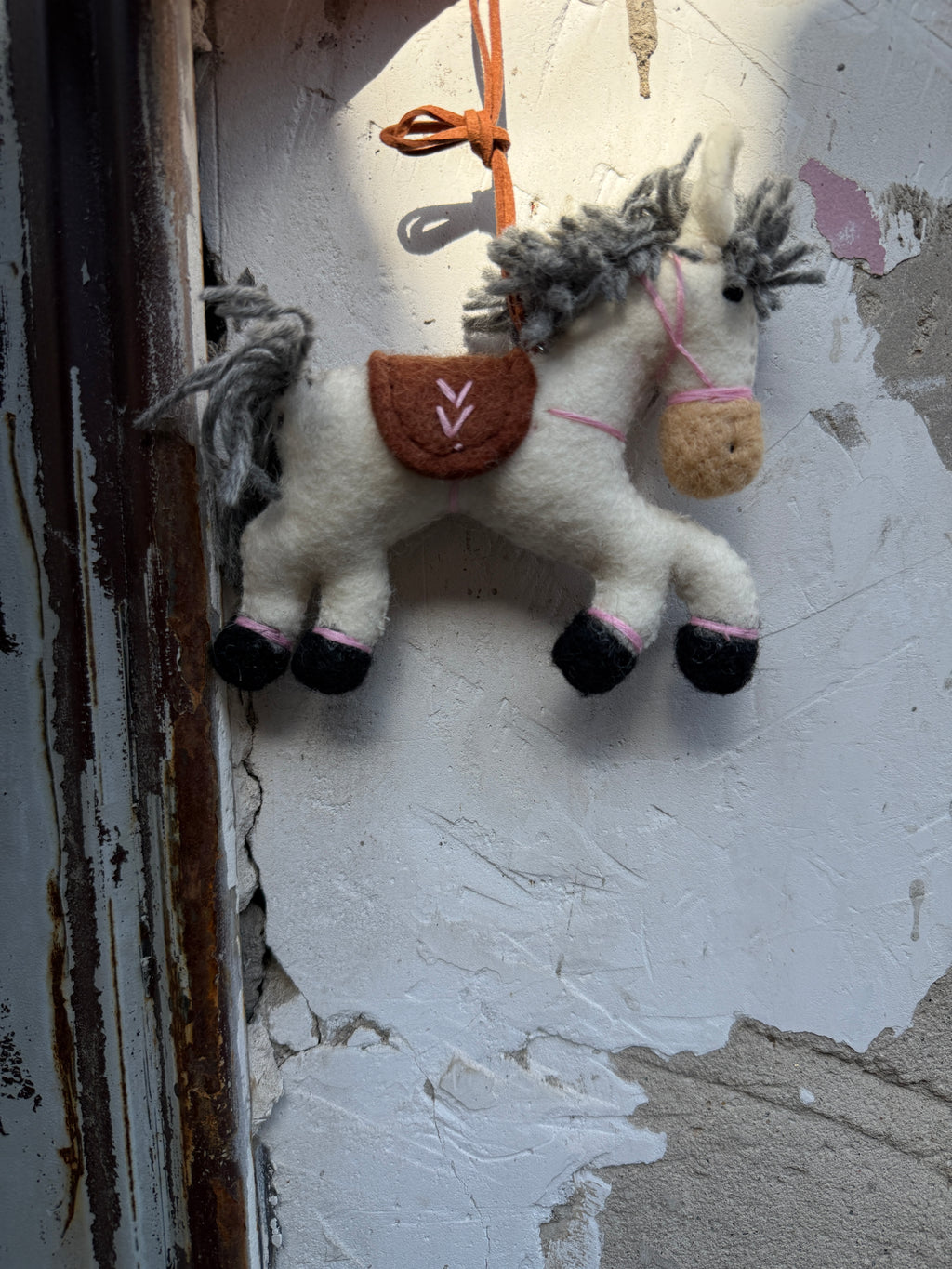 White Pony charm — original lifestyle (from local set)