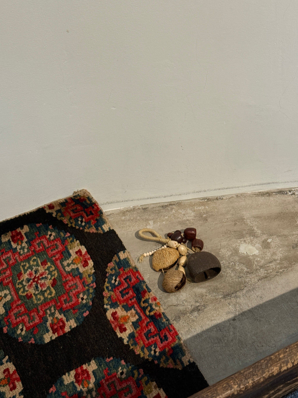 Small rug with geometric pattern on a plain surface
